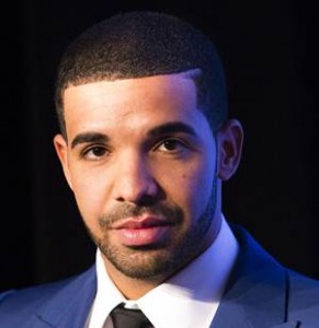Rapper Drake looks on during an announcement that the Toronto Raptors will host the NBA All-Star game in Toronto, September 30, 2013. Toronto was selected as the host of the National Basketball Association's (NBA) 2016 All-Star Game, marking the first time the showcase event will be held outside of the United States, the league said on Monday. REUTERS/Mark Blinch (CANADA - Tags: SPORT BASKETBALL ENTERTAINMENT) - RTR3FFZO